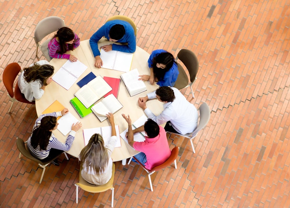 students studying around a table