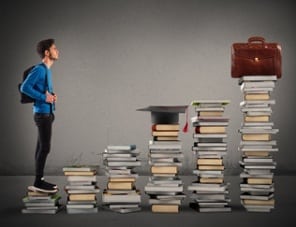 student facing stacks of books